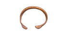Antique African snake cuff bracelet with a rustic handmade texture and warm metallic patina.