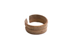 Vintage African cuff bracelet with an aged patina and two raised, textured bands.