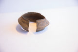 Aged patina and substantial thickness seen at the opening of the handmade African cuff.