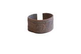 Vintage African cuff bracelet with a rustic, hand-worked texture and dark aged patina.