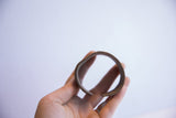 Profile view of the vintage African cuff bracelet highlighting its form and opening.