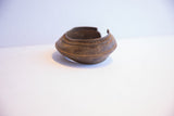 Flared profile and rich, textured patina of a vintage African cuff bracelet.