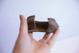 The interior curve and thick edge of the collectible African cuff bracelet.