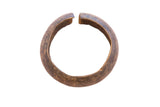 Vintage African cuff bracelet with a thick, rounded body and a warm, aged patina.