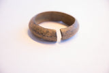 View of the vintage African cuff's open ends, showing its thickness and aged patina.
