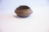 Angled view of the vintage African cuff's handcrafted form and rustic patina.
