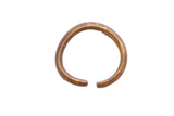 Vintage African cuff bracelet with a rustic, hand-forged texture and aged patina.
