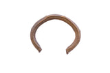 Vintage African cuff bracelet with a rustic, handmade texture and aged bronze patina.