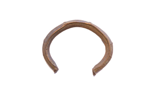 Vintage African cuff bracelet with a rustic, handmade texture and aged bronze patina.