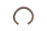 Collectible vintage African cuff bracelet with a textured, time-softened patina.