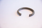 Aged patina and simple, open form of the vintage African cuff.