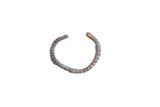 Vintage African oxidized cuff bracelet with a segmented, textured body and rustic patina.
