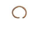 Vintage African cuff bracelet with a segmented design and antiqued gold finish.