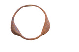 Vintage handmade Yoruba rattle bracelet with a circular form and rich, oxidized patina.