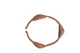 Vintage African Yoruba dance rattle bracelet with pod-shaped segments and a rustic, oxidized patina.