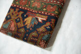 Detail of the thick, textured wool pile on the antique Kurdish Hamadan rug art.