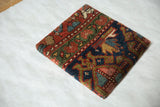 Angled profile of the decorative Kurdish rug art, showing its thick gallery-wrapped edge and texture.