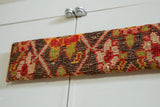 Close profile view of the antique Karabagh rug art, showing its textural depth.