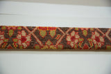 The mounted edge profile of the antique Karabagh rug art, showing its thickness.