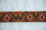 Hand-knotted pile and geometric design of an antique Armenian Karabagh rug fragment.