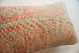 Hand-knotted pile of vintage rug fragment pillow, showcasing faded rose and muted sage pattern.