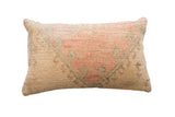 Vintage hand-knotted pillow with faded peach and muted green pattern on natural beige, 20x12.