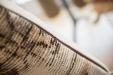 Vintage Rug Fragment Pillow's visible woven texture, subtle pattern, and brown piping detail.