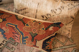 Antique Bijar pillow fragment's deep red, sapphire blue palmette and vine motifs.