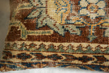 Reciprocating pawn border design on antique Ziegler Mahal fragment in chestnut, jade, sapphire.