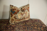 Textured surface of antique Ziegler Mahal fragment pillow in chestnut, powder blue.