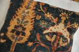 Antique Ziegler Mahal fragment pillow with textured deep blue, rust, and gold botanical motifs.