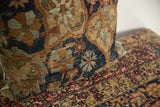 Pillow side profile with lustrous pile, abrashed powder blue and dusty orange floral motifs.