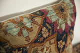 Lustrous early 19th-century Kerman pillow: cochineal red, abrash blue texture.