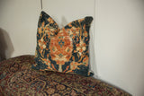 Antique Ziegler Mahal pillow with dark teal, rust, and beige cypress tree motif, worn texture.