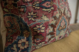 Vintage Meshed rug fragment pillow's intricate floral pattern in rich burgundy, sky blue, and ivory.