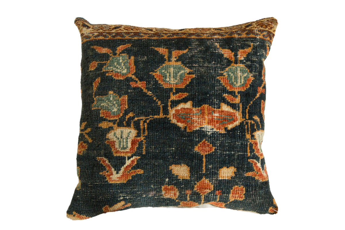 Antique Ziegler Mahal rug fragment pillow with floral motifs in jade, rust, and powder blue on a deep blue field.
