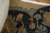 Antique Kerman fragment pillow detail: lustrous dark blue, abrashed teal wool, visible foundation.