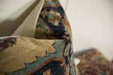 Antique Kerman fragment pillow with glossy wool texture, cochineal red, blue, and orange shades.