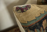 Close-up of Kerman fragment pillow corner, showing visible foundation, cochineal red, and abrashed powder blue.