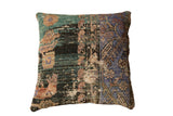 Distressed Anatolian rug fragment pillow with teal, indigo, and brown tones, 24 inches square.