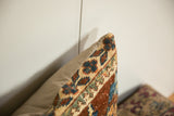 Corner seam of a Ziegler Mahal rug pillow showing the antique woven pile joined to the fabric backing.