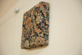 Side view showing the depth and woven texture of the antique Fereghan rug art board.