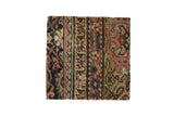 Antique Persian Fereghan rug fragment art showing tiered borders and a germinating blossom design.