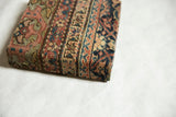 Corner profile of the Fereghan rug art, showing the wrapped texture and two-inch board depth.