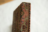 Side profile view of the decorative art showing the antique Fereghan fragment's depth.