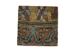 Antique Kerman rug fragment cork board with floral motifs in gold, muted red, and blue-green.