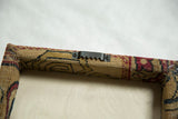 Sawtooth hanger and wrapped corners on the back of the decorative rug art frame.