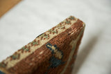 Detail of the thick, textured wool pile on the antique Ziegler Mahal rug fragment corner.