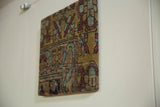 Side profile of the decorative rug art, highlighting the wrapped antique textile and board depth.