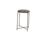 Side table with a cushioned top made from a navy and saffron antique Persian rug fragment.